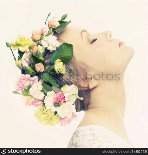 Beautiful young woman with delicate flowers in their hair