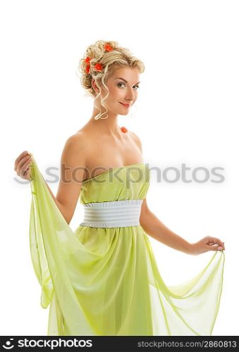Beautiful young woman with fresh spring flowers in her hair.