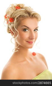 Beautiful young woman with fresh spring flowers in her hair.