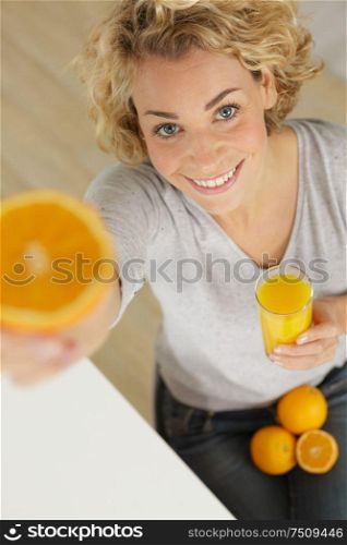 beautiful young woman with glass of orange juice