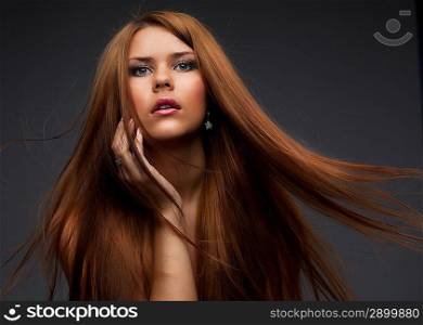 Beautiful young woman with hair flying
