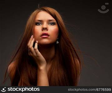 Beautiful young woman with hair flying