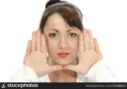Beautiful young woman with hand, palm out, beside face.