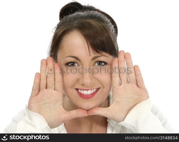Beautiful young woman with hands, palms out, beside face.