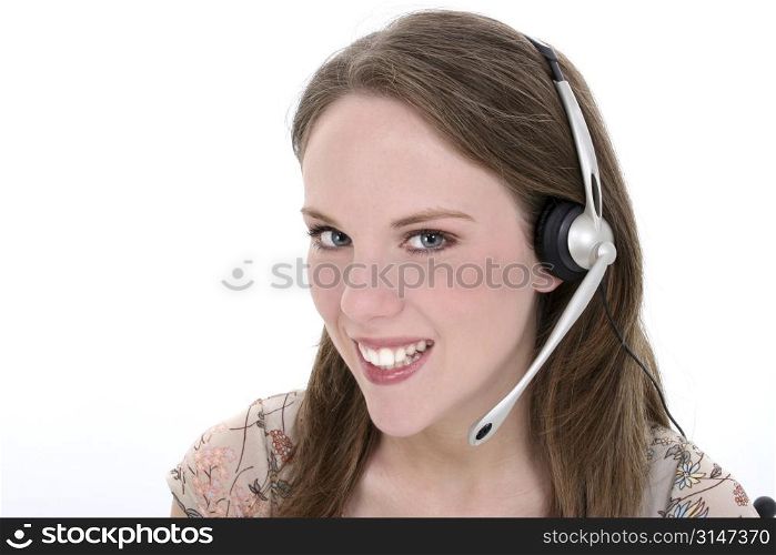 Beautiful young woman with headset and big smile over white. Great for customer service, hotline or just gossiping with friends.