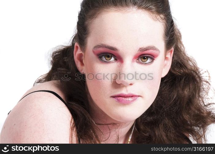 Beautiful young woman with heavy pink make-up