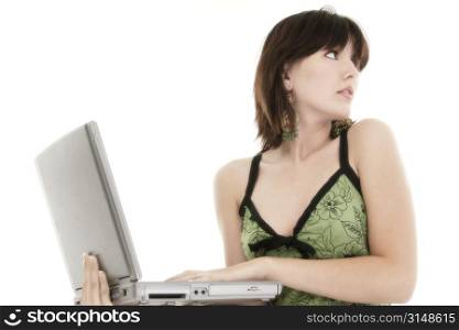 Beautiful young woman with laptop. Looking over shoulder.