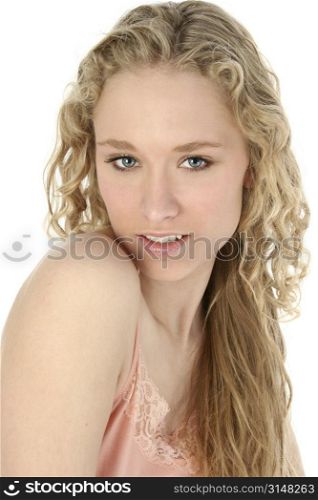 Beautiful young woman with long curly hair and blue eyes. Light make-up, great skin and teeth. Shot in studio over white.