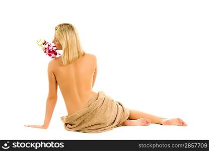 Beautiful young woman with orchid flower isolated on white background
