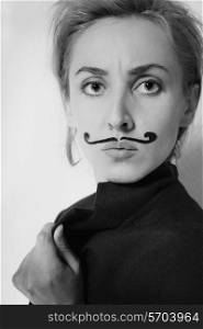 beautiful young woman with painted mustache wearing jacket