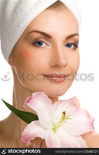Beautiful young woman with pink lily