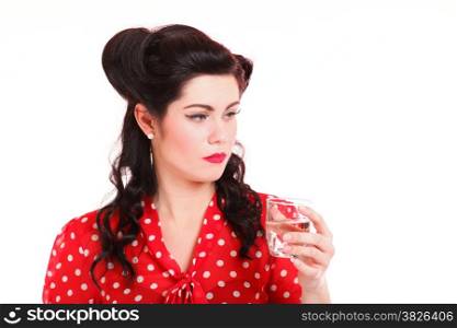 Beautiful young woman with pinup makeup and hairstyle drinking water white background