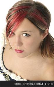 Beautiful young woman with red, blonde, and black highlights in her hair. Shot in studio over white.