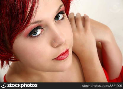 Beautiful young woman with red hair close up.