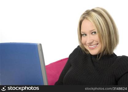 Beautiful young woman with short blonde hair, working on computer.
