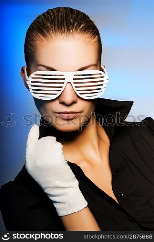 Beautiful young woman with stylish shutter shades sunglasses