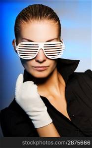 Beautiful young woman with stylish shutter shades sunglasses