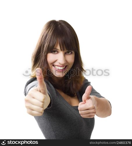 Beautiful young woman with thumbs up isolated on a white, focus is on the face