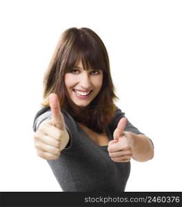 Beautiful young woman with thumbs up isolated on a white, focus is on the face
