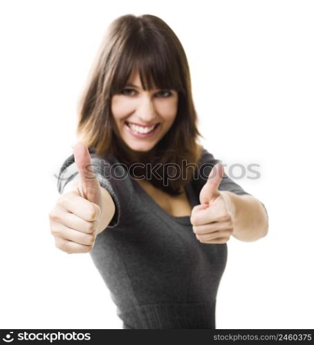 Beautiful young woman with thumbs up isolated on a white, focus is on the hands