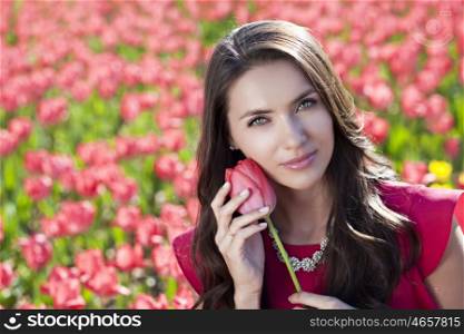 Beautiful young woman with tulips