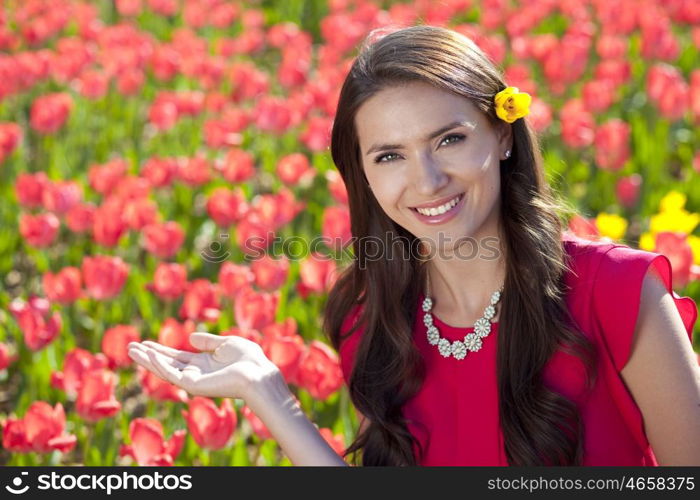 Beautiful young woman with tulips