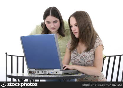 Beautiful Young Woman Working Together On Laptop. At bistro table.