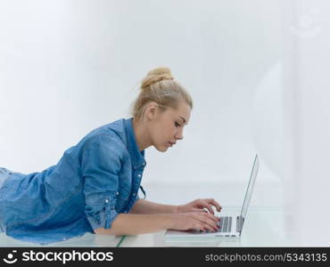 beautiful young women using laptop computer on the floor at home