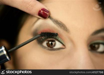 beautifull indian woman eye make up macro detail