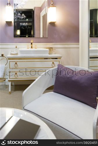 Beautifully Bright Restroom with Gold, White and Purple Furnishings
