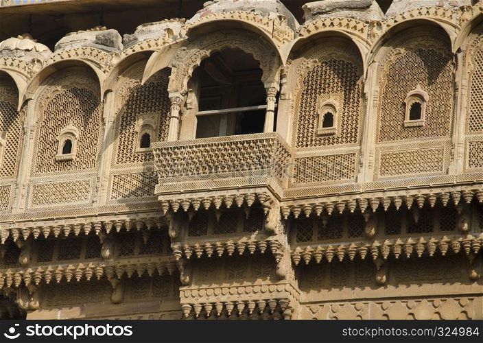 Beautifully carved windows situated in the fort complex, Jaisalmer, Rajasthan, India. Beautifully carved windows situated in the fort complex, Jaisalmer, Rajasthan, India.