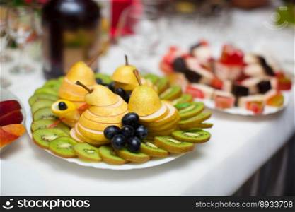 beautifully cut fresh fruit on the holiday table