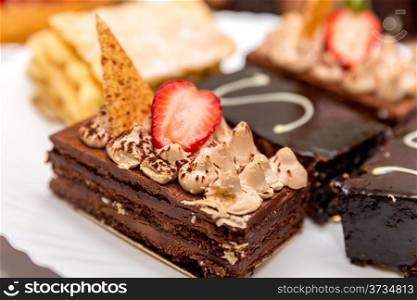 Beautifully decorated chocolate brownie with strawberry topping