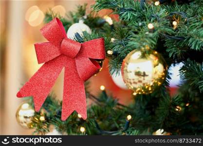 Beautifully decorated Christmas tree with blurred background. Concept for Christmas holidays and winter season.