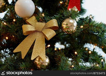 Beautifully decorated Christmas tree with blurred background. Concept for Christmas holidays and winter season.