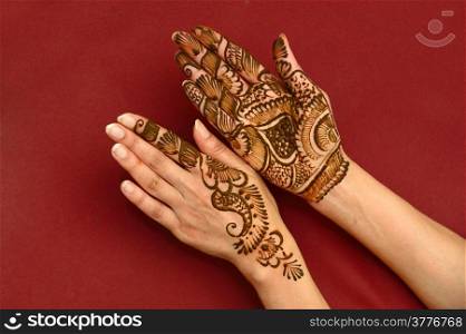 beautifully decorated indian hands with mehandi typically done for weddings