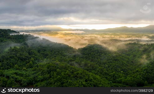 Beautifully Landscape Aerial view panoramic at sunrise with fog above mountain in Mae Moh, Lampang, Thailand, Drone.. Landscape at sunrise with fog above mountain.