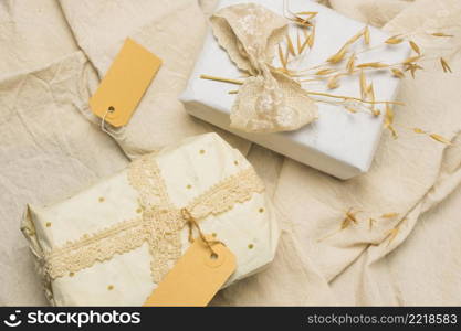 beautifully wrapped gift boxes with tags textured fabric