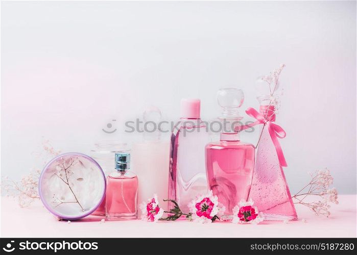 Beauty and cosmetic bottles in pastel color, front view