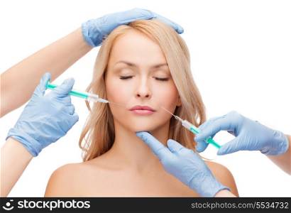 beauty and cosmetic surgery concept - woman with closed eyes and beautician hands with syringes