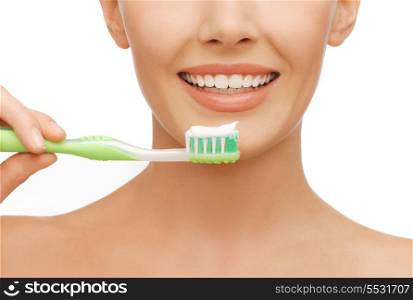 beauty and dental health concept - beautiful woman with green toothbrush