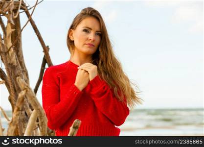 Beauty and fashion of women. Fashionable woman resting outdoor. Portrait of attractive gorgeous long haired lady in red.. Portrait of gorgeous fashionable woman outdoor.