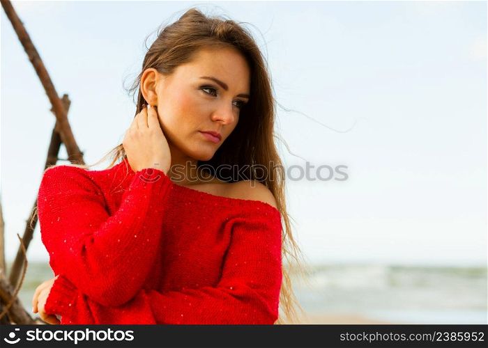Beauty and fashion of women. Fashionable woman resting outdoor. Portrait of attractive gorgeous long haired lady in red.. Portrait of gorgeous fashionable woman outdoor.