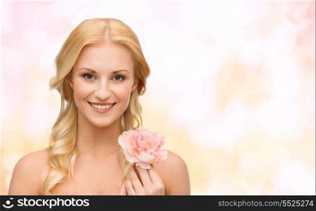 beauty and floral concept - bright picture of smiling woman with peony flower