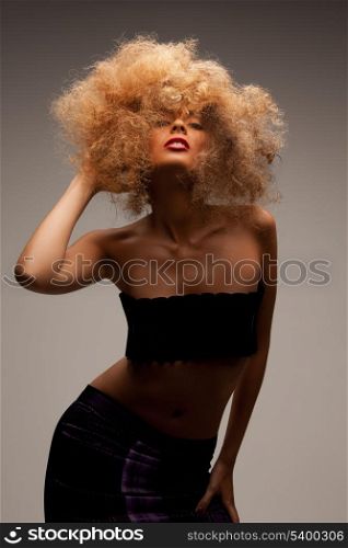 beauty and glamour concept - woman with long curly hair