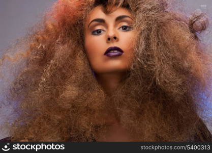 beauty and glamour concept - woman with long curly hair