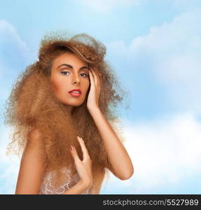 beauty and glamour concept - woman with long curly hair in sexy white lace lingerie