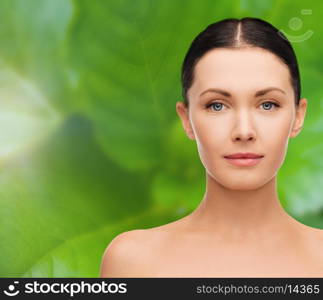 beauty and health concept - face and shoulders of beautiful woman