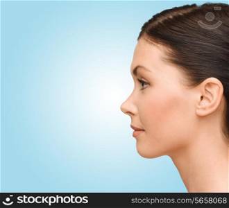 beauty and health concept - profile portrait of young woman