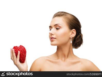 beauty and jewelry concept - beautiful woman with shiny diamond earrings and heart